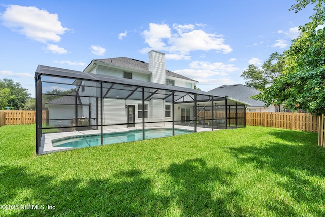 1008 Durbin Parke Dr, Saint Johns, FL 32259 - rear view of house with glass enclosure, a chimney, and a patio area