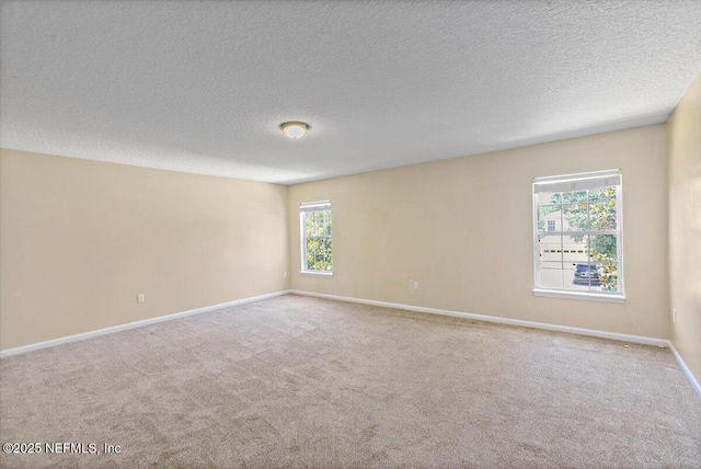 1147 Hyacinth St, Saint Augustine, FL 32092 - spare room featuring carpet flooring, baseboards, and a textured ceiling