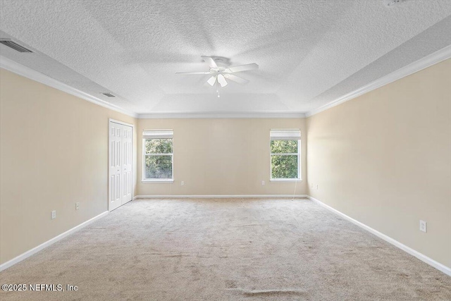 1147 Hyacinth St, Saint Augustine, FL 32092 - carpeted spare room with ornamental molding, a ceiling fan, baseboards, a textured ceiling, and a raised ceiling