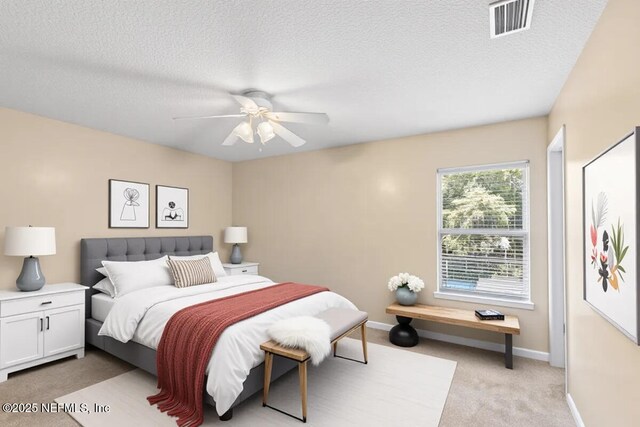 1147 Hyacinth St, Saint Augustine, FL 32092 - bedroom featuring light colored carpet, a textured ceiling, baseboards, and ceiling fan