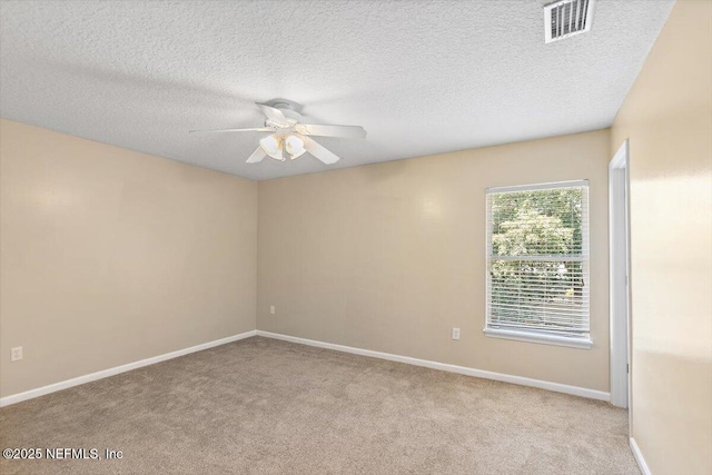1147 Hyacinth St, Saint Augustine, FL 32092 - spare room with a ceiling fan, carpet, baseboards, and a textured ceiling