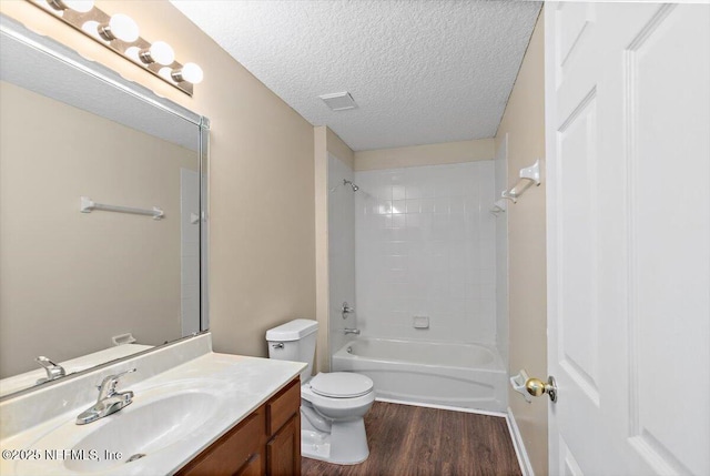 1147 Hyacinth St, Saint Augustine, FL 32092 - full bathroom with vanity, toilet, wood finished floors, shower / bathtub combination, and a textured ceiling