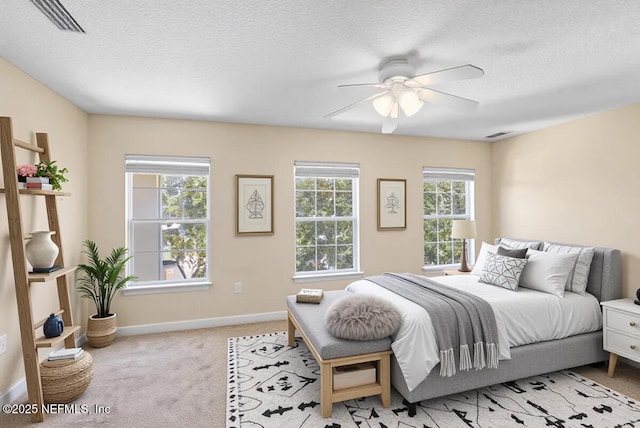 1147 Hyacinth St, Saint Augustine, FL 32092 - bedroom with light carpet, a textured ceiling, baseboards, and a ceiling fan