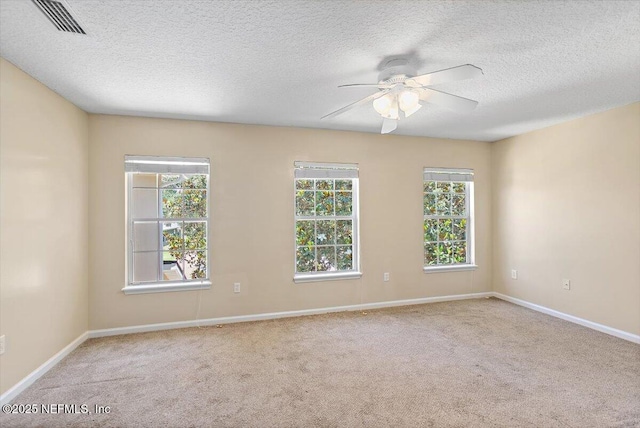 1147 Hyacinth St, Saint Augustine, FL 32092 - carpeted empty room with a ceiling fan, a textured ceiling, and baseboards