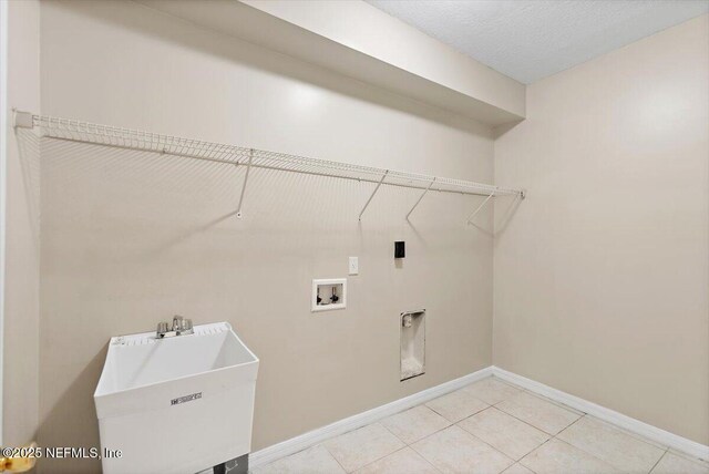 1147 Hyacinth St, Saint Augustine, FL 32092 - laundry room featuring washer hookup, light tile patterned floors, and baseboards