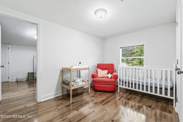 9160 Wild Rd, Jacksonville, FL 32220 - bedroom with wood finished floors and baseboards