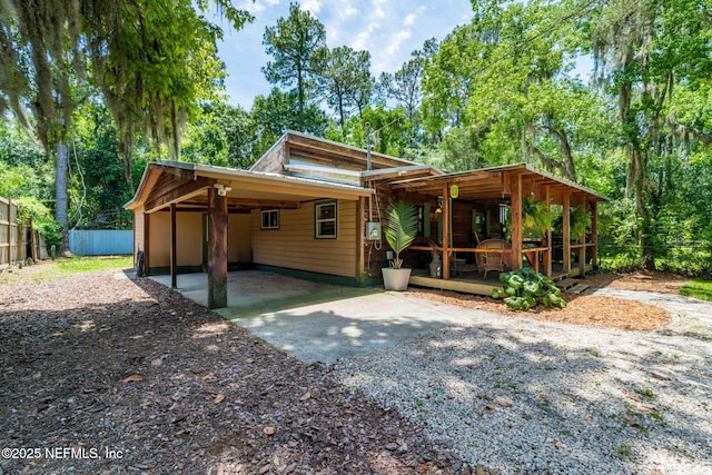 9160 Wild Rd, Jacksonville, FL 32220 - view of front of home with driveway and an attached carport
