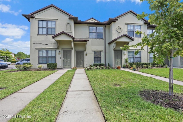 650 Drake Bay Ter, Saint Augustine, FL 32084 - view of property with stucco siding and a front yard