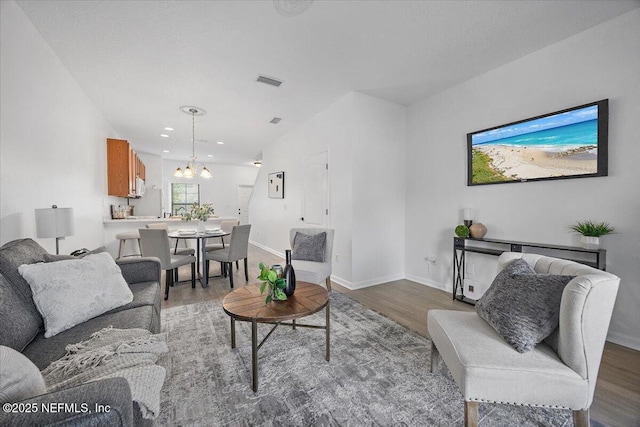 650 Drake Bay Ter, Saint Augustine, FL 32084 - living room featuring a chandelier, wood finished floors, recessed lighting, and baseboards