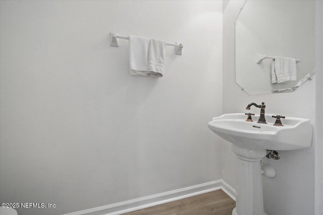 650 Drake Bay Ter, Saint Augustine, FL 32084 - bathroom featuring baseboards and wood finished floors