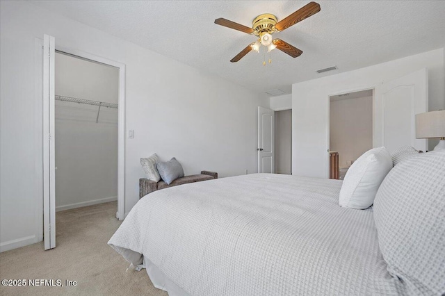 650 Drake Bay Ter, Saint Augustine, FL 32084 - bedroom with a walk in closet, light colored carpet, a closet, ceiling fan, and baseboards