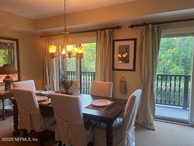 955 Registry Blvd Unit 229, Saint Augustine, FL 32092 - carpeted dining area featuring a chandelier and healthy amount of natural light