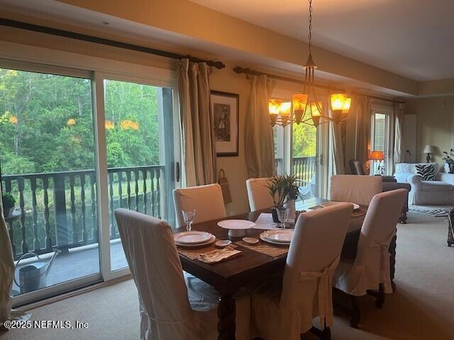 955 Registry Blvd Unit 229, Saint Augustine, FL 32092 - carpeted dining area featuring a chandelier