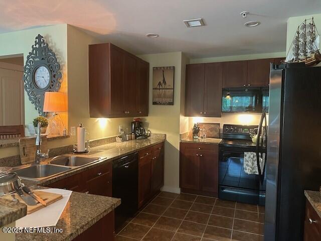 955 Registry Blvd Unit 229, Saint Augustine, FL 32092 - kitchen with black appliances, dark tile patterned flooring, and recessed lighting
