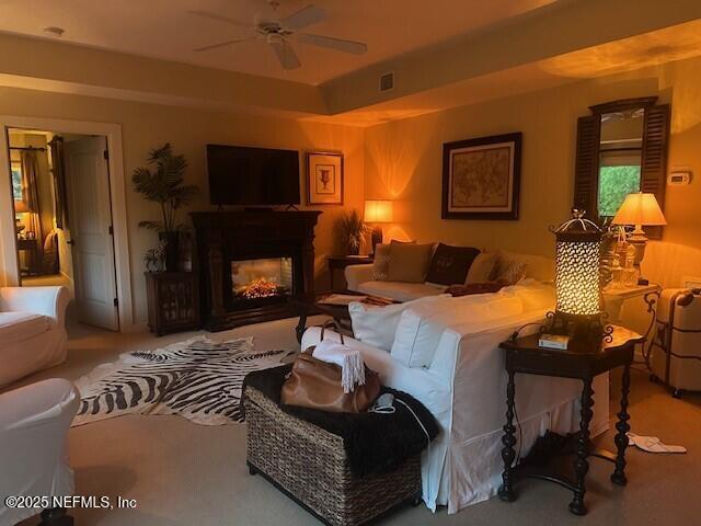 955 Registry Blvd Unit 229, Saint Augustine, FL 32092 - living area with ceiling fan, a multi sided fireplace, and carpet flooring