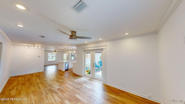 26 Sailfish Dr, Ponte Vedra Beach, FL 32082 - unfurnished living room featuring crown molding, light wood-style flooring, baseboards, a ceiling fan, and french doors