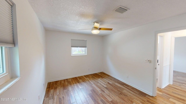 26 Sailfish Dr, Ponte Vedra Beach, FL 32082 - spare room with light wood-style floors, a ceiling fan, a textured ceiling, and baseboards