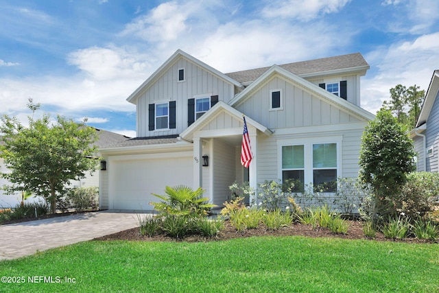 95 Farmers Branch Ave, Ponte Vedra, FL 32081 - view of front of house featuring board and batten siding, driveway, a front lawn, a garage, and roof with shingles