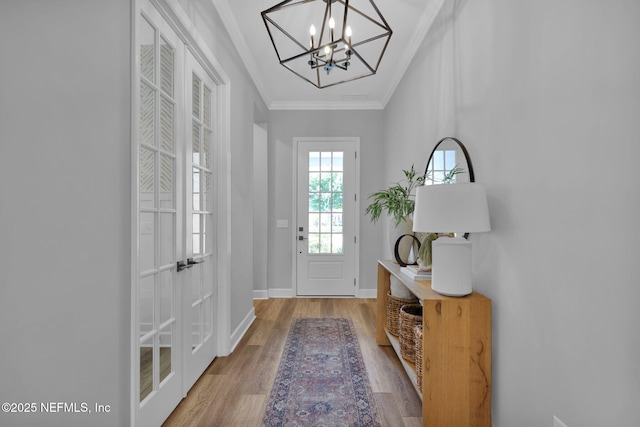 95 Farmers Branch Ave, Ponte Vedra, FL 32081 - foyer entrance featuring ornamental molding, wood finished floors, a chandelier, and baseboards
