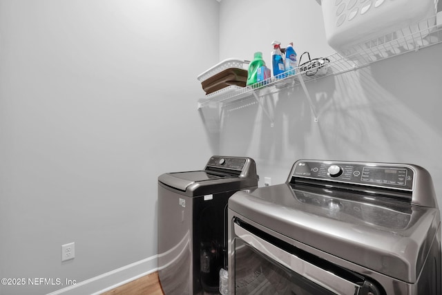 95 Farmers Branch Ave, Ponte Vedra, FL 32081 - laundry area featuring washing machine and dryer, baseboards, and wood finished floors