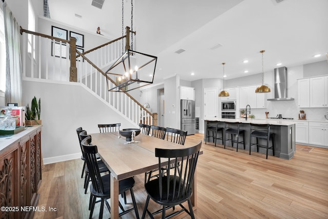 95 Farmers Branch Ave, Ponte Vedra, FL 32081 - dining area featuring stairway, light wood-type flooring, recessed lighting, and baseboards