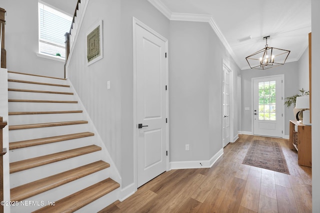95 Farmers Branch Ave, Ponte Vedra, FL 32081 - foyer featuring ornamental molding, wood finished floors, a chandelier, stairway, and baseboards