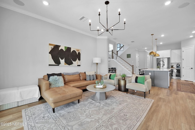 95 Farmers Branch Ave, Ponte Vedra, FL 32081 - living area featuring beverage cooler, recessed lighting, light wood-style flooring, crown molding, and stairs