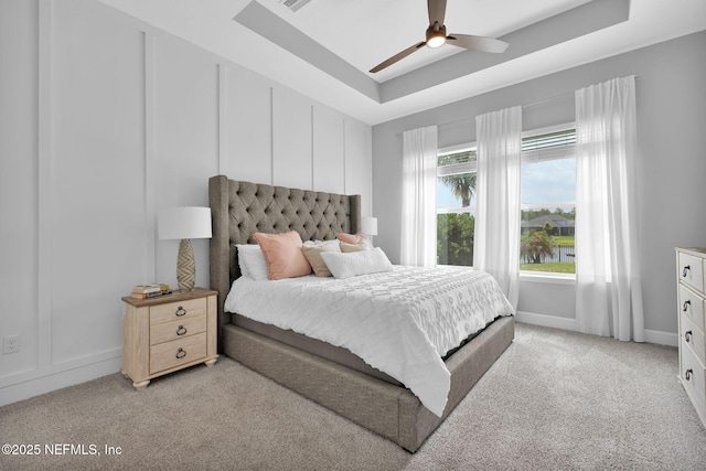 95 Farmers Branch Ave, Ponte Vedra, FL 32081 - bedroom featuring light colored carpet, a raised ceiling, baseboards, and a ceiling fan