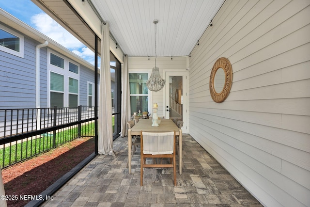 95 Farmers Branch Ave, Ponte Vedra, FL 32081 - sunroom / solarium with a chandelier and outdoor dining area