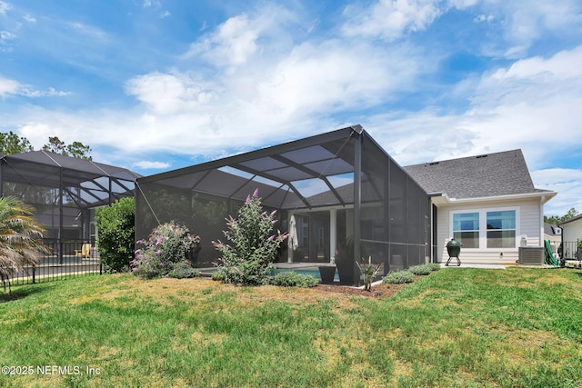 95 Farmers Branch Ave, Ponte Vedra, FL 32081 - back of property featuring a lawn, glass enclosure, a shingled roof, and central air condition unit