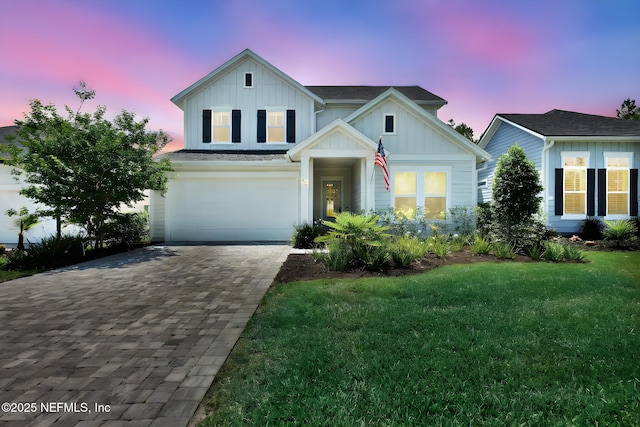 95 Farmers Branch Ave, Ponte Vedra, FL 32081 - view of front of property with decorative driveway, board and batten siding, a lawn, and a garage