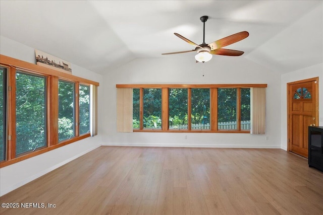 404 Camelia Trl, Saint Augustine, FL 32086 - unfurnished living room with lofted ceiling, light wood-type flooring, a ceiling fan, and baseboards