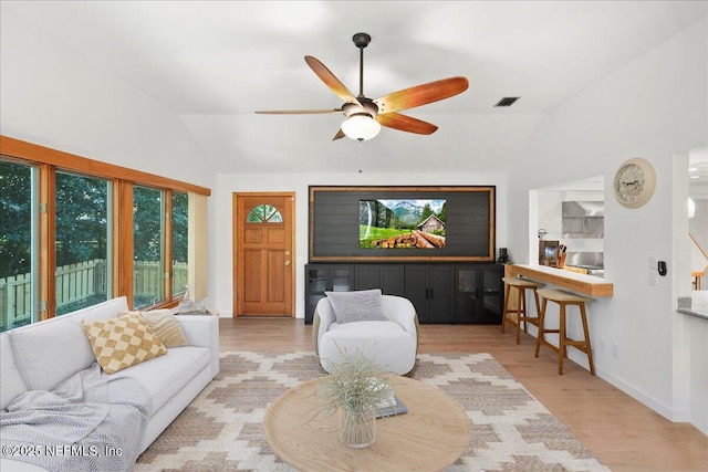 404 Camelia Trl, Saint Augustine, FL 32086 - living room featuring vaulted ceiling, a ceiling fan, wood finished floors, and baseboards