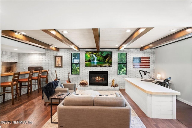 404 Camelia Trl, Saint Augustine, FL 32086 - living room featuring a fireplace, wood finished floors, brick wall, recessed lighting, and baseboards