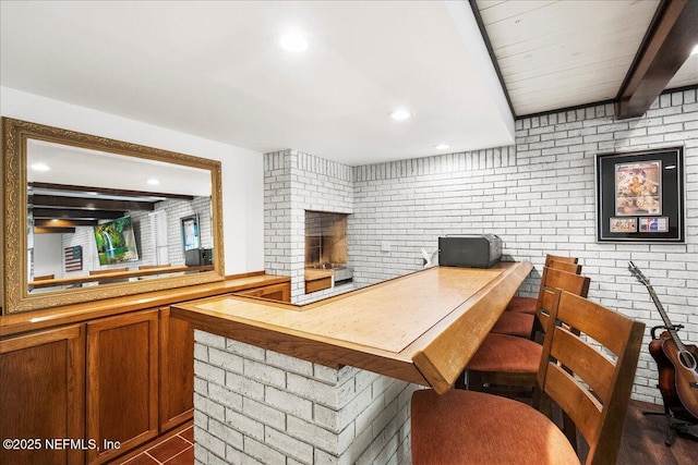 404 Camelia Trl, Saint Augustine, FL 32086 - office area featuring beamed ceiling, brick wall, recessed lighting, and a fireplace