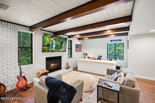 404 Camelia Trl, Saint Augustine, FL 32086 - living room with wood finished floors, a fireplace, brick wall, baseboards, and wood ceiling with exposed beams