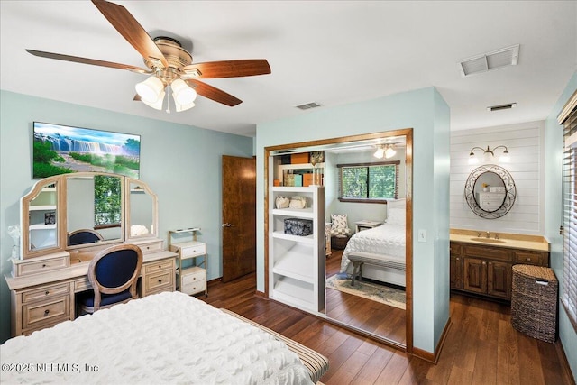 404 Camelia Trl, Saint Augustine, FL 32086 - bedroom with dark wood finished floors, a sink, a ceiling fan, and a closet