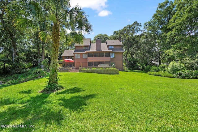 404 Camelia Trl, Saint Augustine, FL 32086 - view of green lawn featuring a sunroom