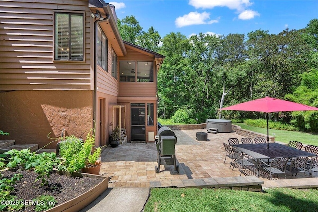 404 Camelia Trl, Saint Augustine, FL 32086 - view of patio with a sunroom, a garden, and outdoor dining area