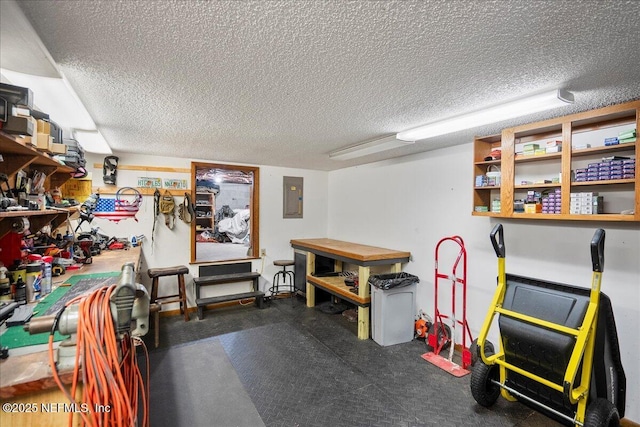404 Camelia Trl, Saint Augustine, FL 32086 - recreation room featuring electric panel, a textured ceiling, and a workshop area