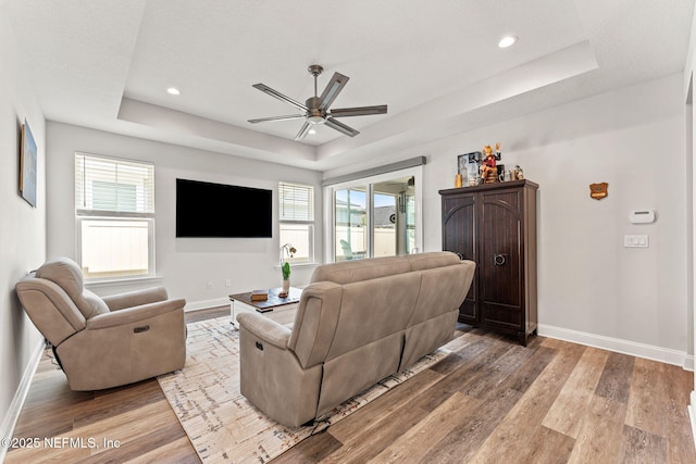 68 Cabana Dr, Ponte Vedra, FL 32081 - living room with a raised ceiling, baseboards, ceiling fan, light wood-type flooring, and recessed lighting