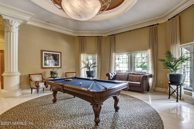 400 E Bay St Unit 1010, Jacksonville, FL 32202 - rec room featuring ornate columns, plenty of natural light, light tile patterned floors, a tray ceiling, and ornamental molding
