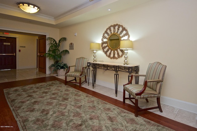 400 E Bay St Unit 1010, Jacksonville, FL 32202 - sitting room featuring crown molding, wood finished floors, and baseboards
