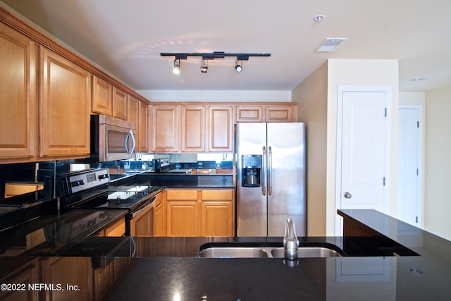 400 E Bay St Unit 1010, Jacksonville, FL 32202 - kitchen featuring stainless steel appliances, dark countertops, and a sink