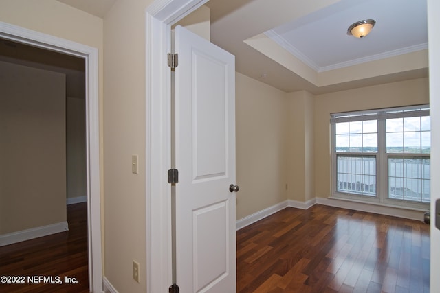 400 E Bay St Unit 1010, Jacksonville, FL 32202 - spare room with dark wood-type flooring, ornamental molding, baseboards, and a tray ceiling