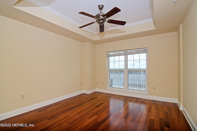 400 E Bay St Unit 1010, Jacksonville, FL 32202 - spare room featuring a raised ceiling, wood finished floors, crown molding, a ceiling fan, and baseboards