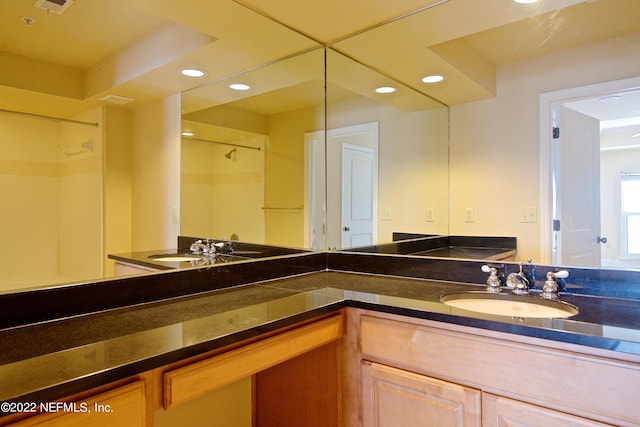 400 E Bay St Unit 1010, Jacksonville, FL 32202 - bathroom featuring recessed lighting, a shower, and vanity