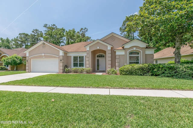 3820 Danforth Dr W, Jacksonville, FL 32224 - view of front of property featuring stucco siding, a garage, concrete driveway, and a front yard