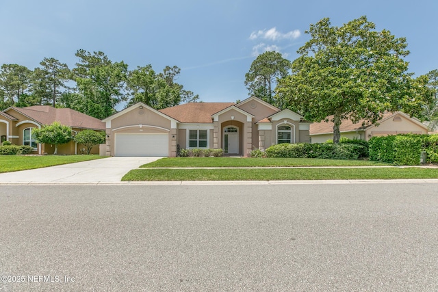 3820 Danforth Dr W, Jacksonville, FL 32224 - view of front of property with a garage, a front lawn, concrete driveway, and stucco siding