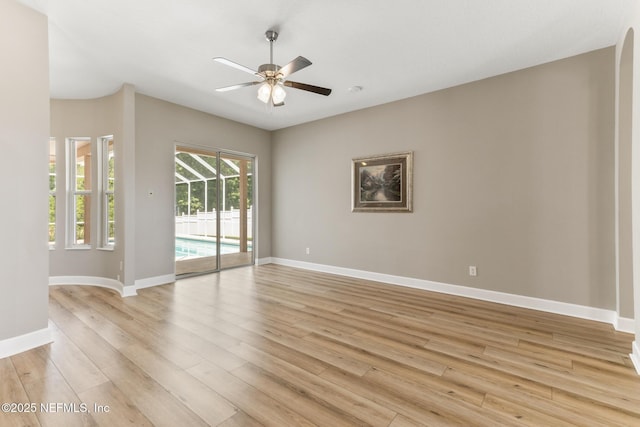 3820 Danforth Dr W, Jacksonville, FL 32224 - spare room featuring light wood-style flooring, ceiling fan, and baseboards